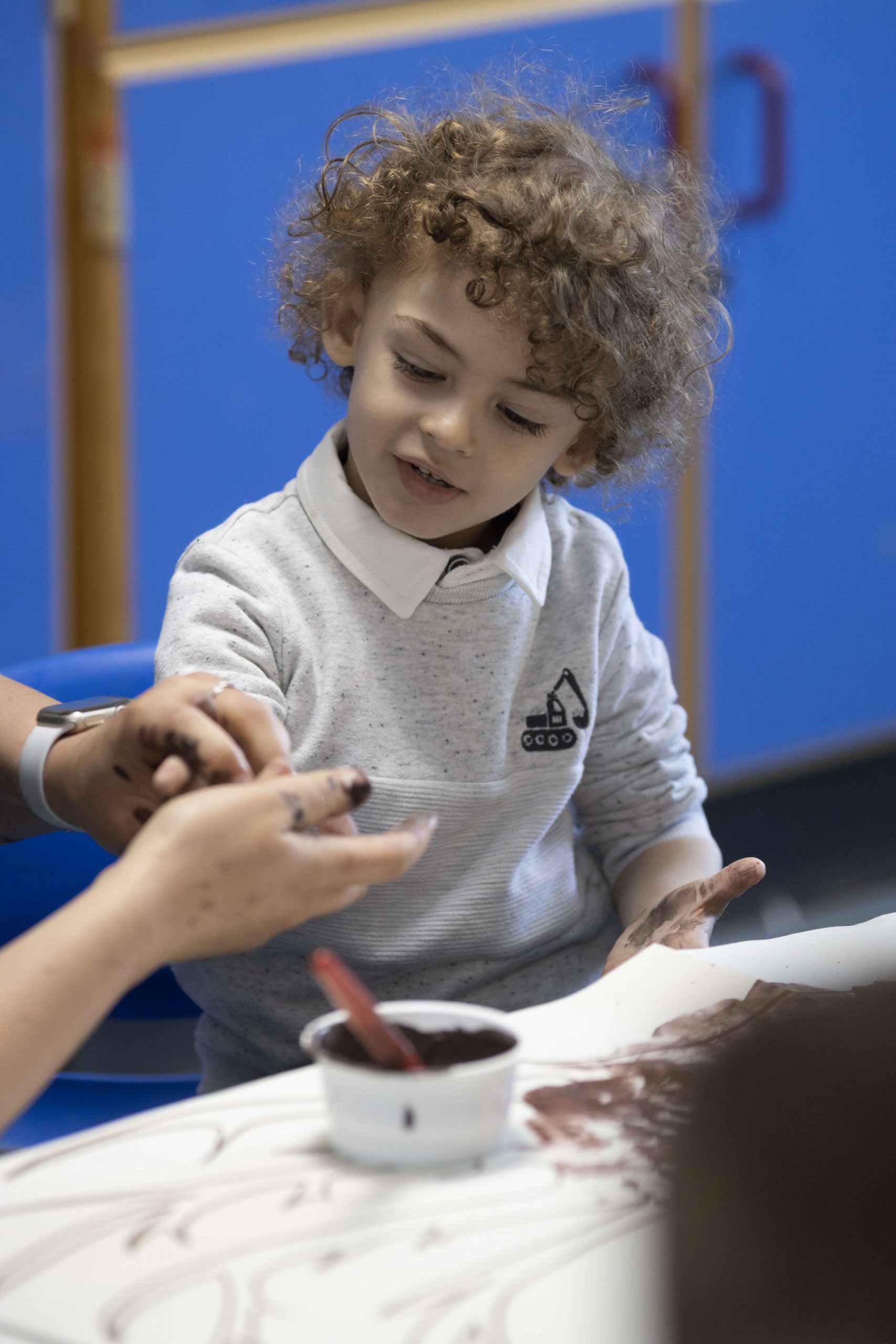 photo of a young pupil painting