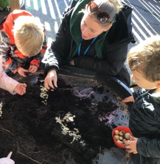 EYFS children learning about the past through enjoying celebrations and exploring changes around them.